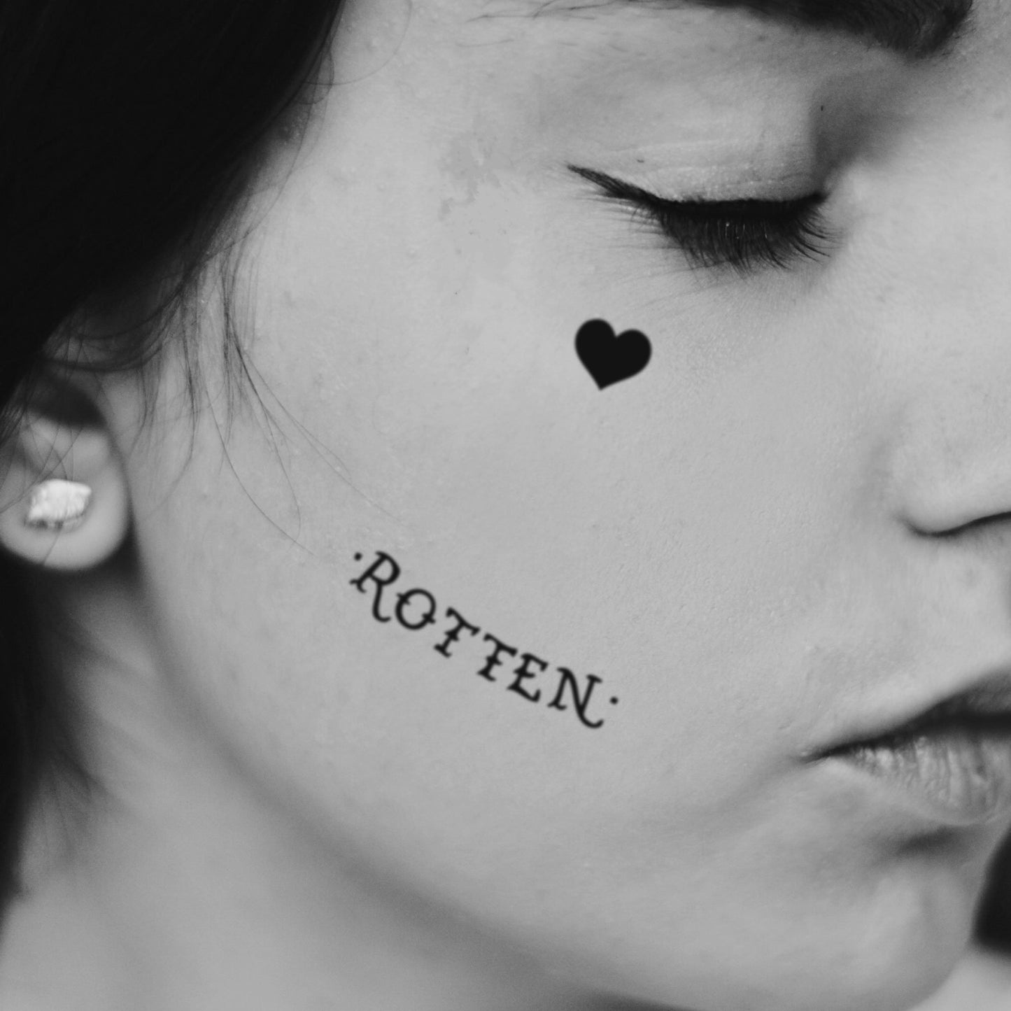 fake small rotten harley quinn joker lettering temporary tattoo sticker design idea on face