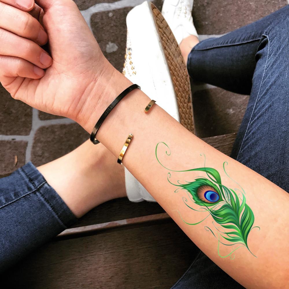 fake medium peacock feather color temporary tattoo sticker design idea on forearm
