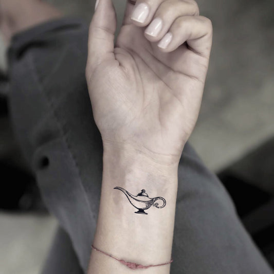 fake small aladdin genie lamp minimalist temporary tattoo sticker design idea on wrist