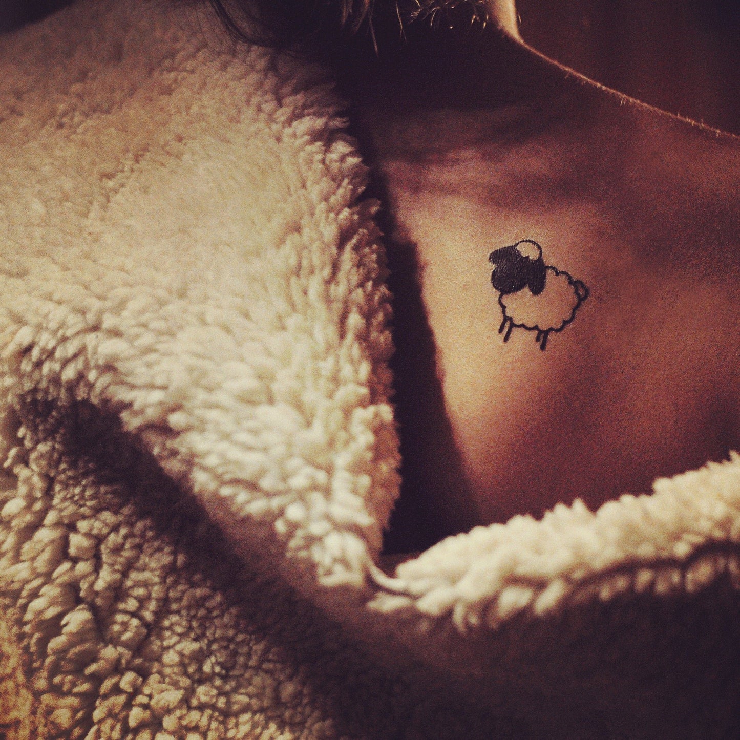 fake small little black sheep animal temporary tattoo sticker design idea on chest