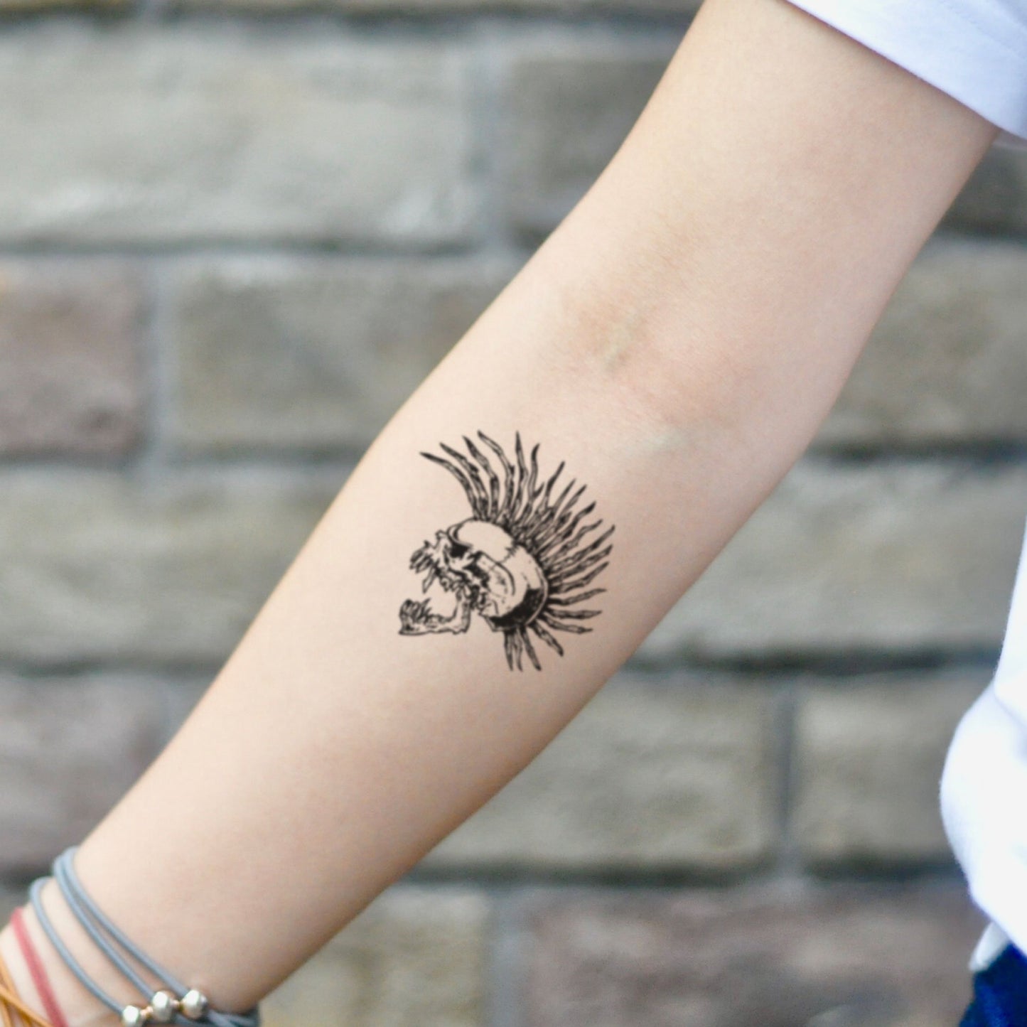 fake small the exploited punky skull punk illustrative temporary tattoo sticker design idea on inner arm